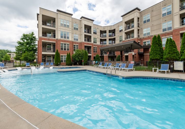 Apartments at Palladian Place building exterior and sparkling pool