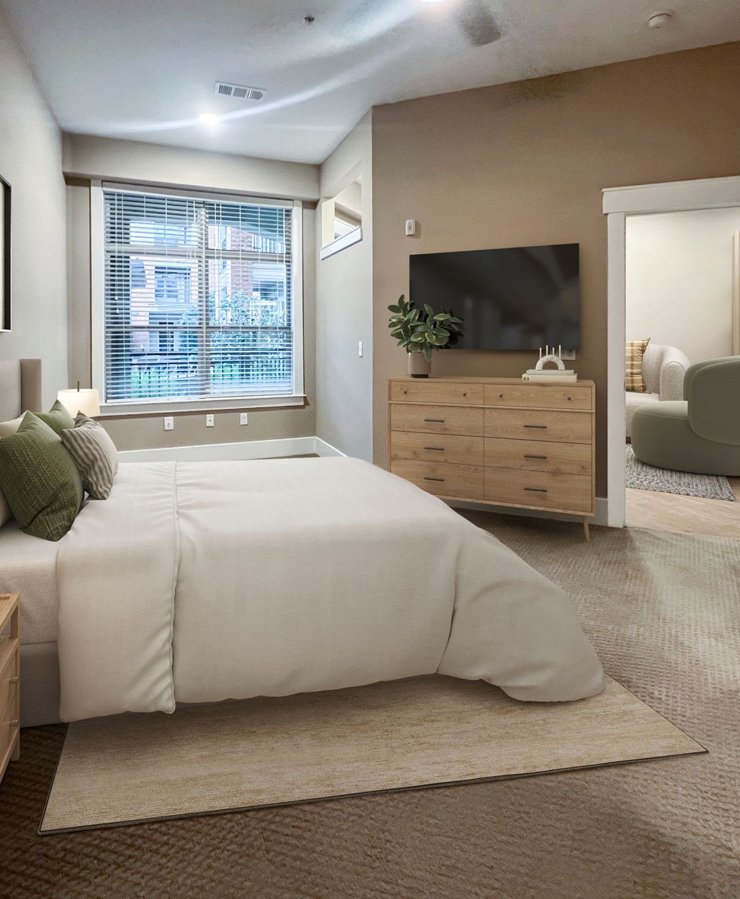 Apartments at Palladian Place in Durham, NC bedroom with large bed, rug, side table, dresser and TV